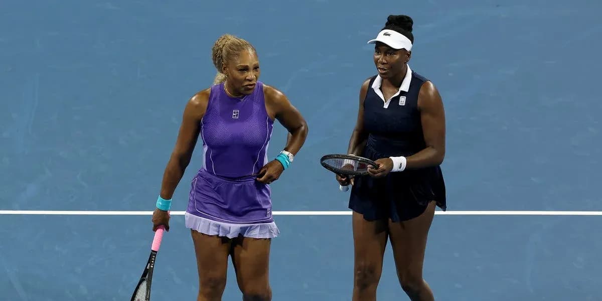 Serena and Venus Williams during doubles match Serena and Venus Williams during doubles match