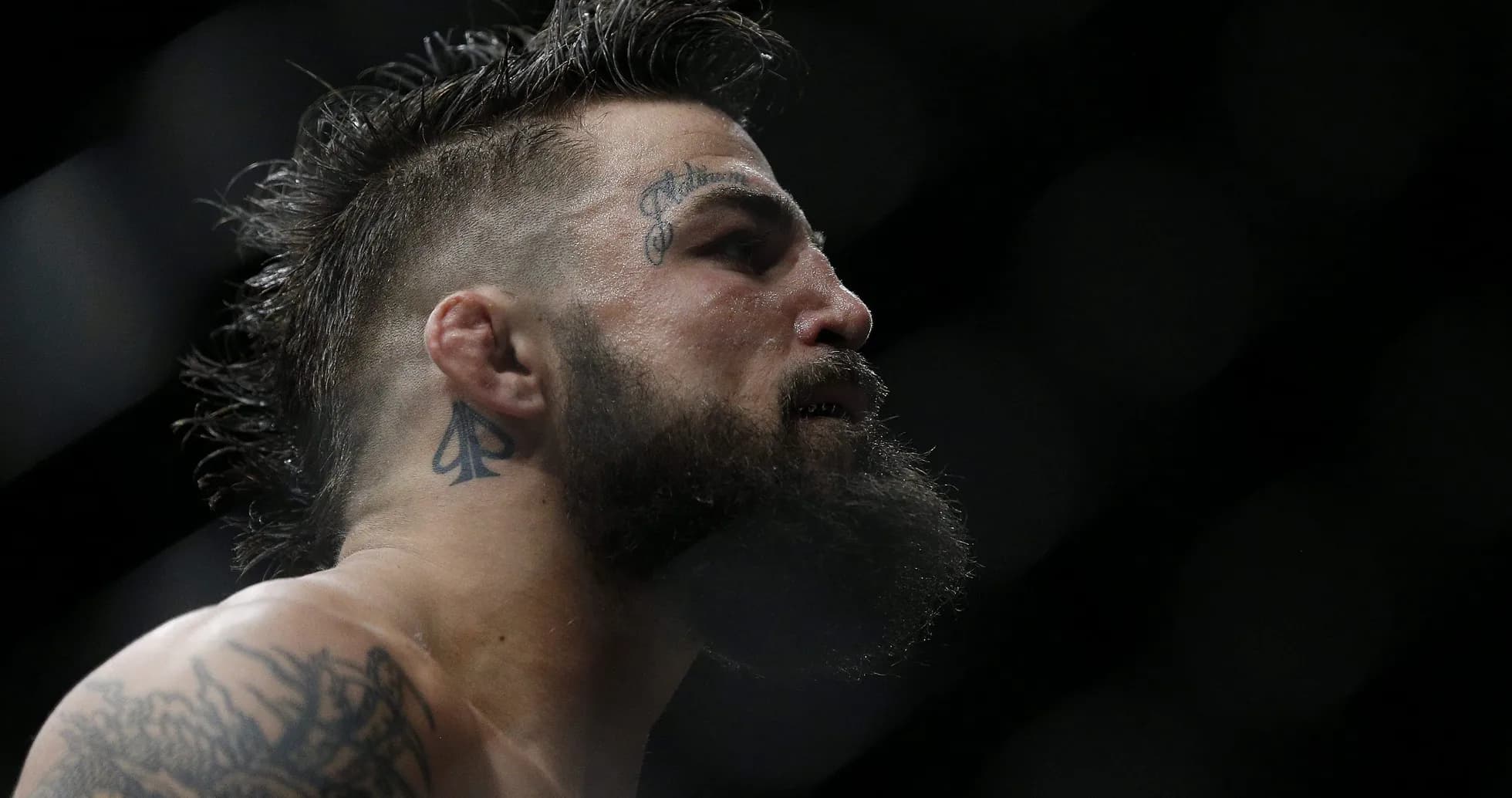 Close-up of fighter with beard and tattoos Close-up of fighter with beard and tattoos