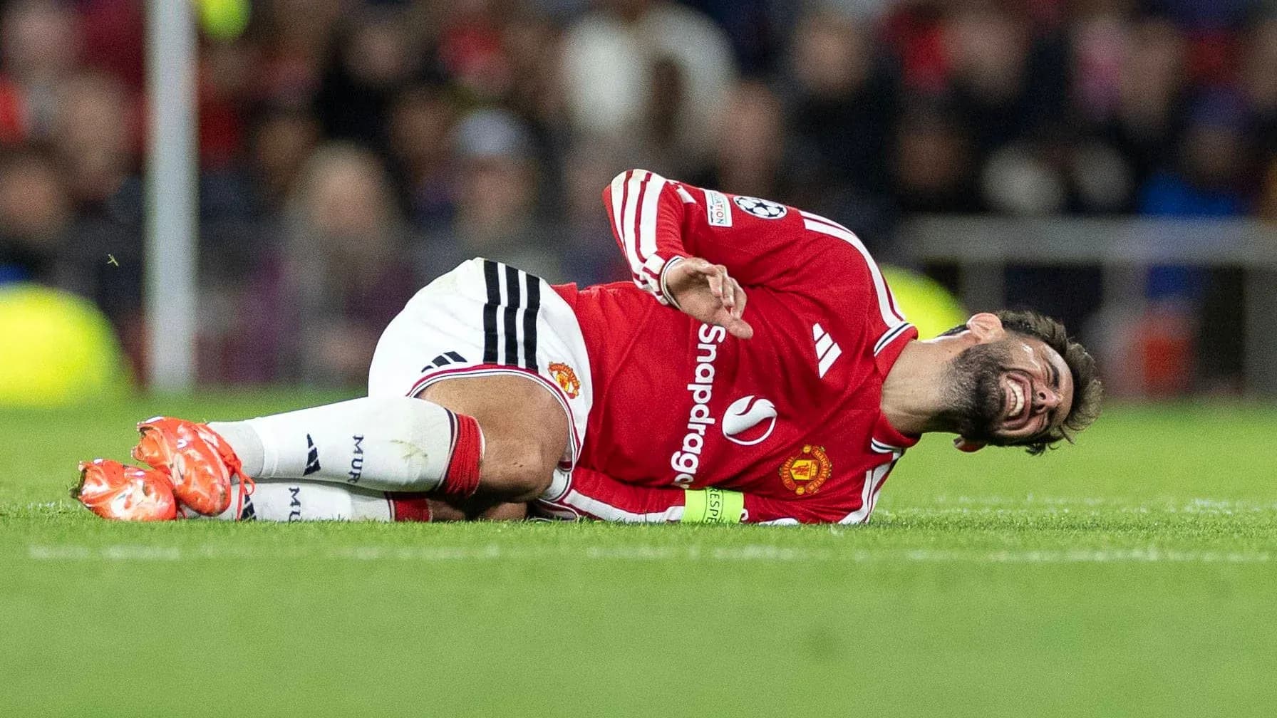 Player lying on pitch after injury during match Player lying on pitch after injury during match