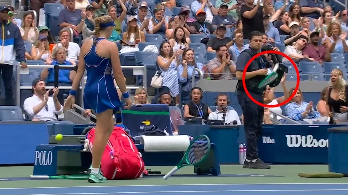 Tennis player on court with spectators applauding Tennis player on court with spectators applauding