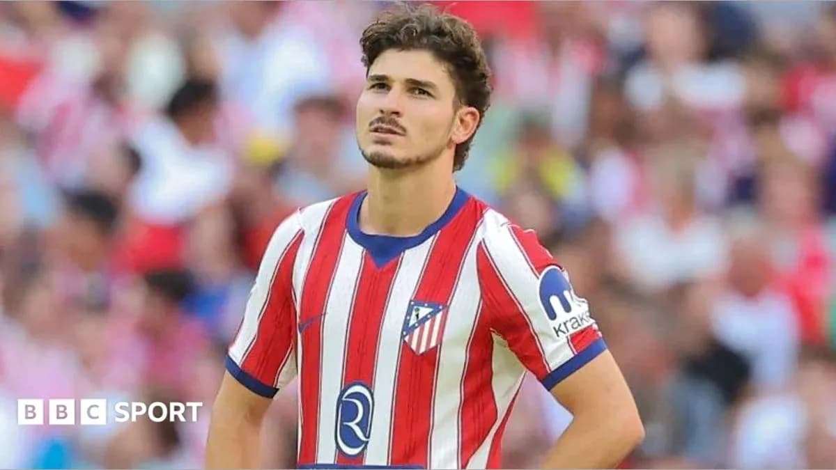 Atletico Madrid player looking concerned during match Atletico Madrid player looking concerned during match