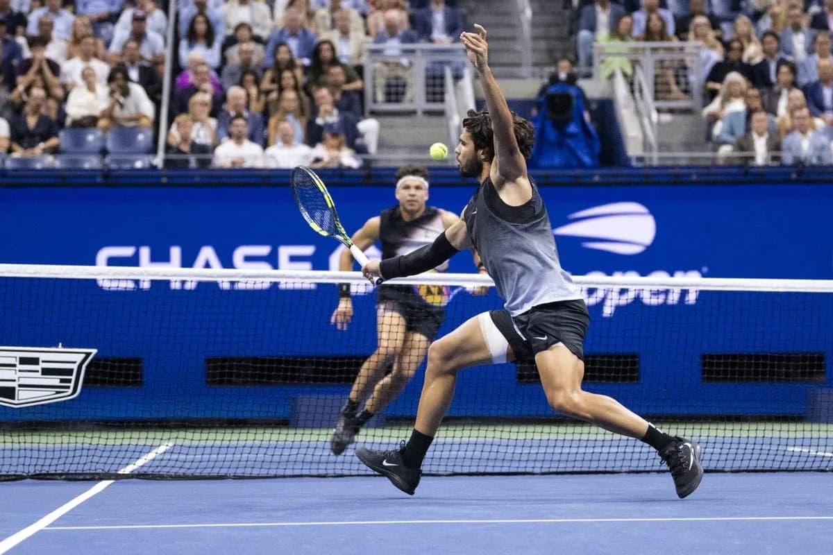 Player hitting a tennis ball during a match Player hitting a tennis ball during a match