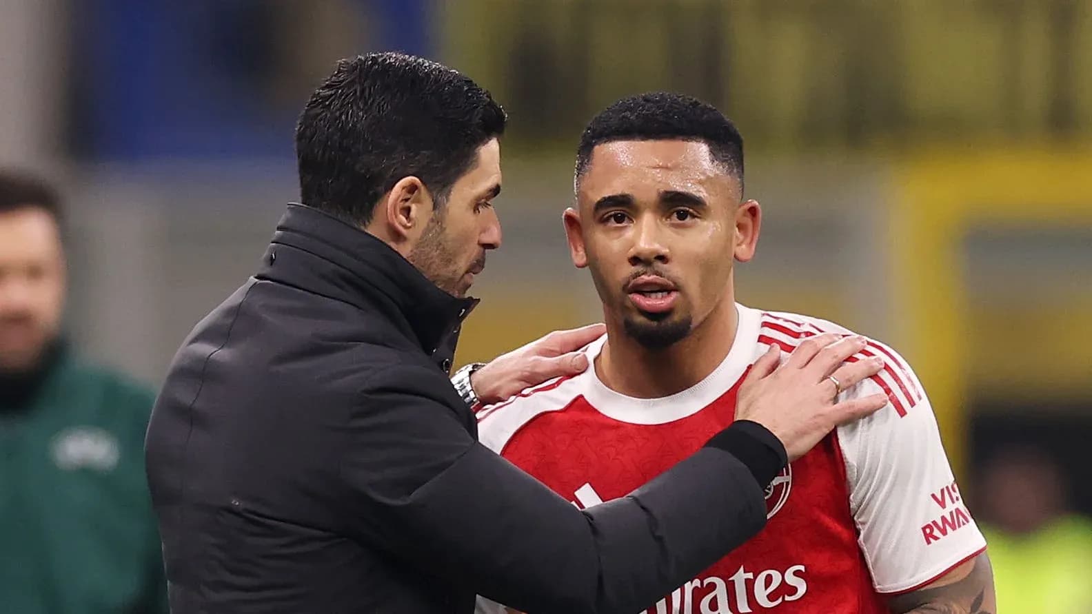 Manager speaking with player during match substitution Manager speaking with player during match substitution