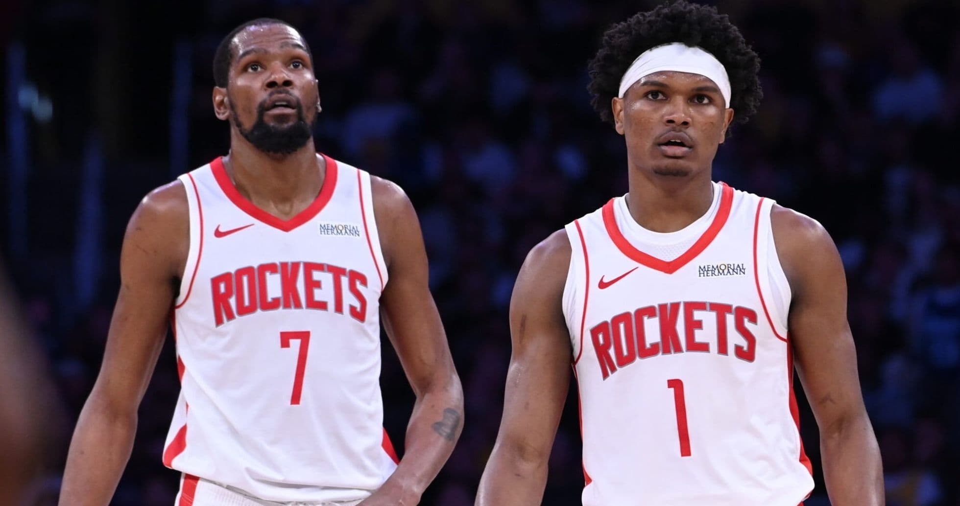 Two Houston Rockets players on the court Two Houston Rockets players on the court