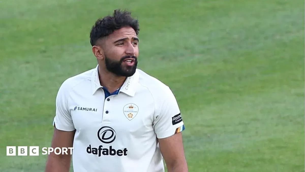Cricketer in white kit on the field Cricketer in white kit on the field