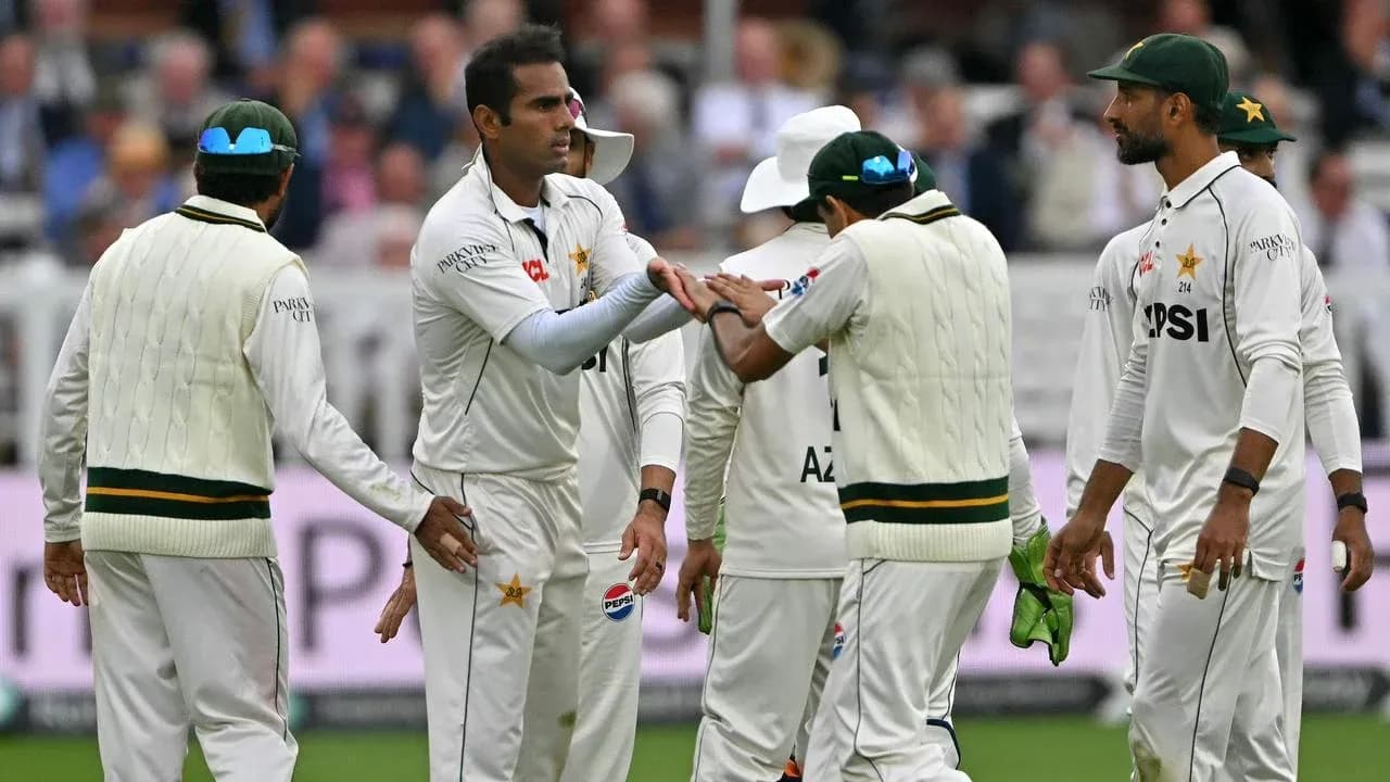 Pakistani players celebrating a wicket on the field Pakistani players celebrating a wicket on the field