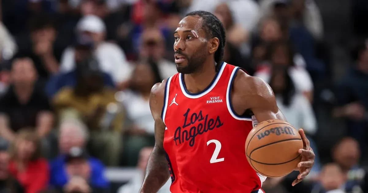 Player dribbling basketball during game action Player dribbling basketball during game action