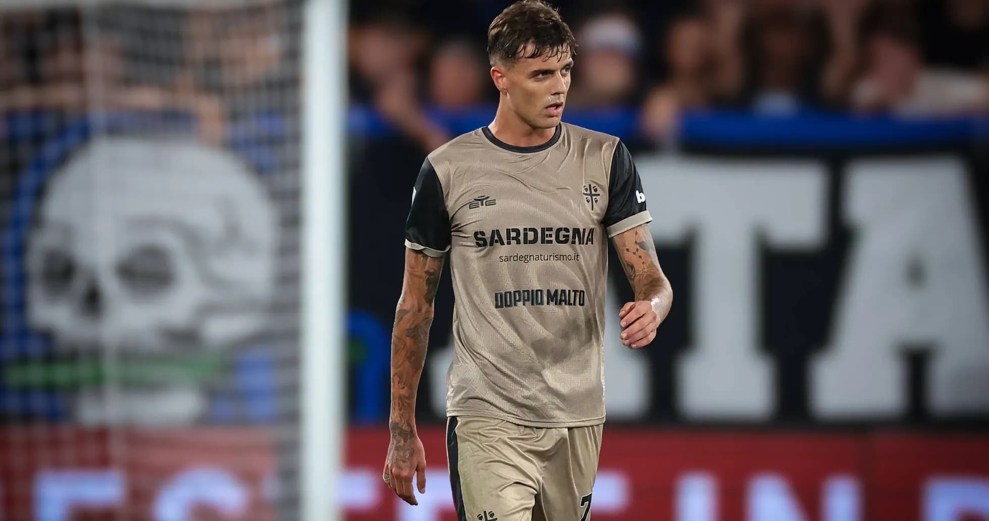 Player walking on the pitch in match uniform Player walking on the pitch in match uniform
