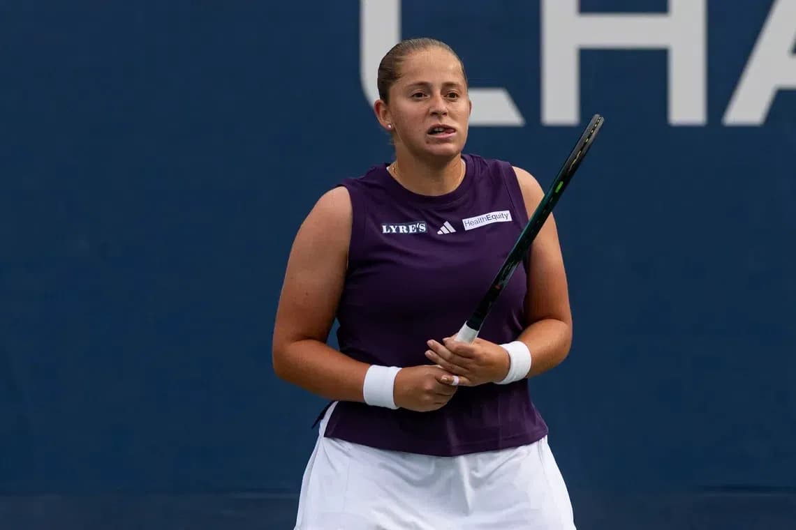 Tennis player holding racket during match Tennis player holding racket during match