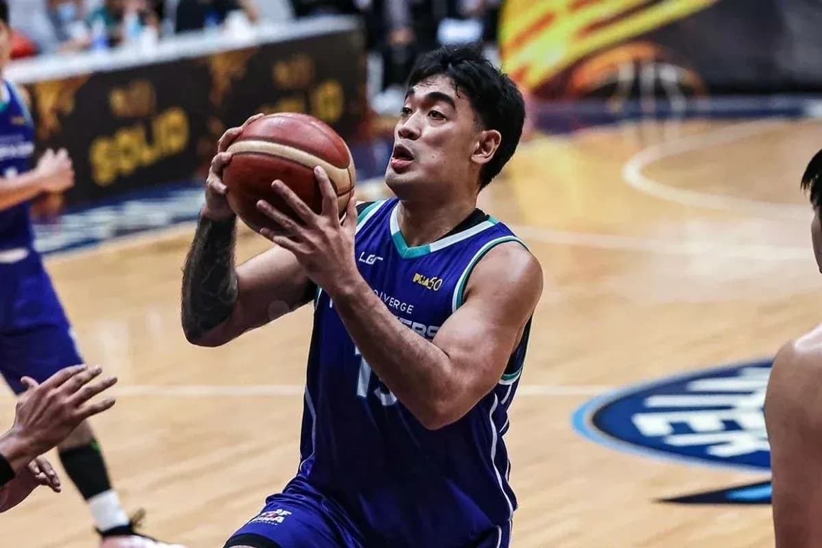 Player shooting a basketball during a game Player shooting a basketball during a game