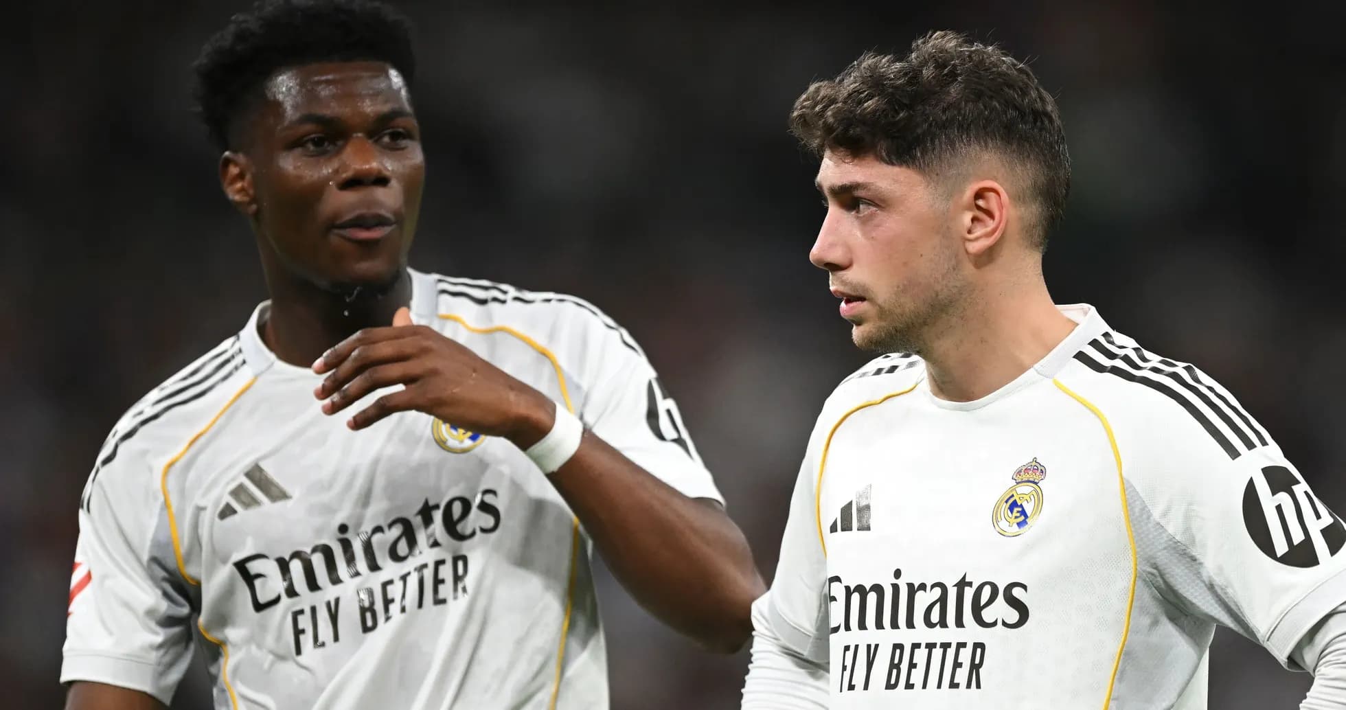 Two Real Madrid players discussing on the pitch Two Real Madrid players discussing on the pitch
