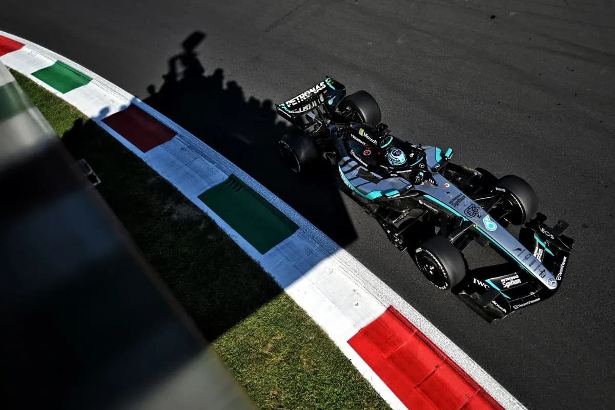 Formula 1 car navigating track with Italian flag colors Formula 1 car navigating track with Italian flag colors