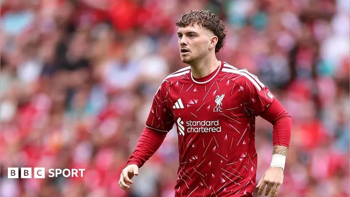 Liverpool player running on the pitch during match Liverpool player running on the pitch during match