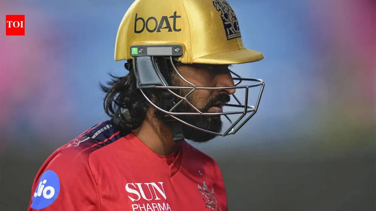 Cricketer wearing a gold helmet during match Cricketer wearing a gold helmet during match