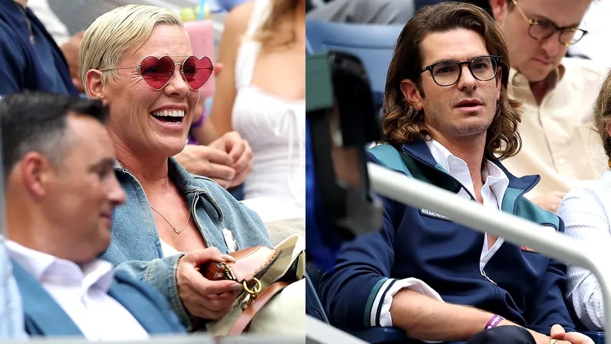 Two spectators watching a tennis match in stands Two spectators watching a tennis match in stands