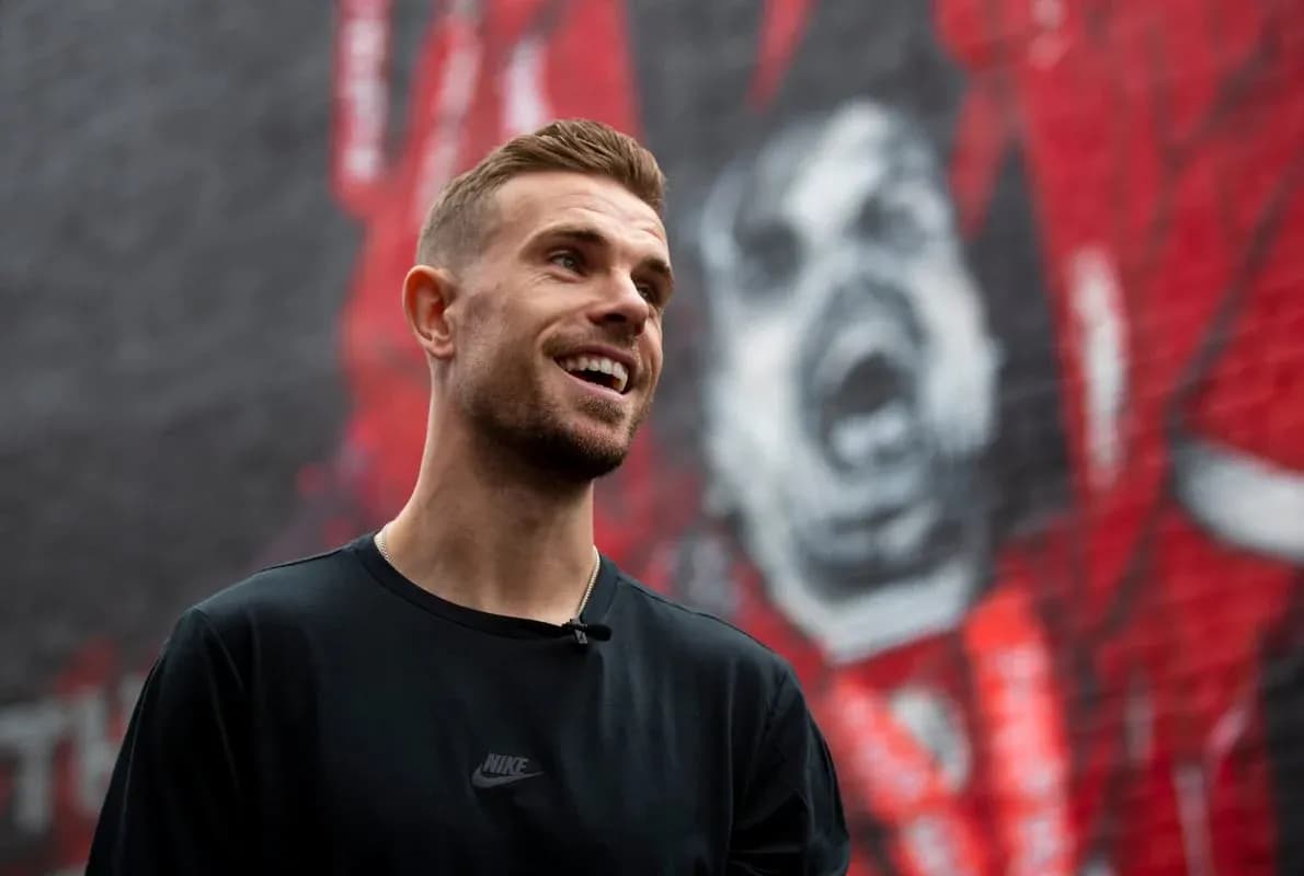 Player smiling in front of a mural backdrop Player smiling in front of a mural backdrop