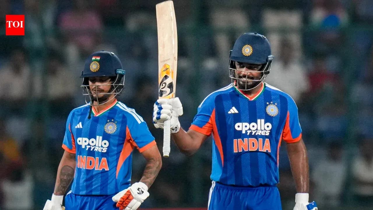 Two Indian cricketers celebrating on the field Two Indian cricketers celebrating on the field
