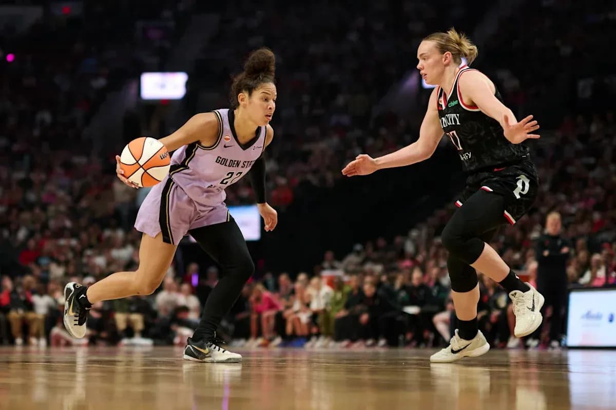 Player dribbling ball while being defended during game Player dribbling ball while being defended during game