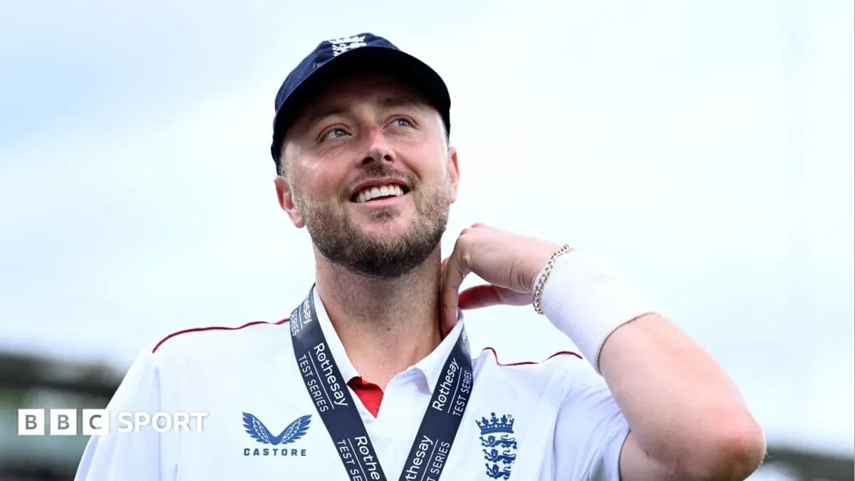 Cricketer wearing medal and smiling at ceremony Cricketer wearing medal and smiling at ceremony