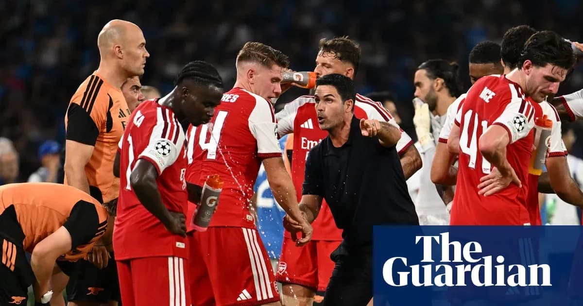 Arsenal players receiving instructions from manager during match Arsenal players receiving instructions from manager during match