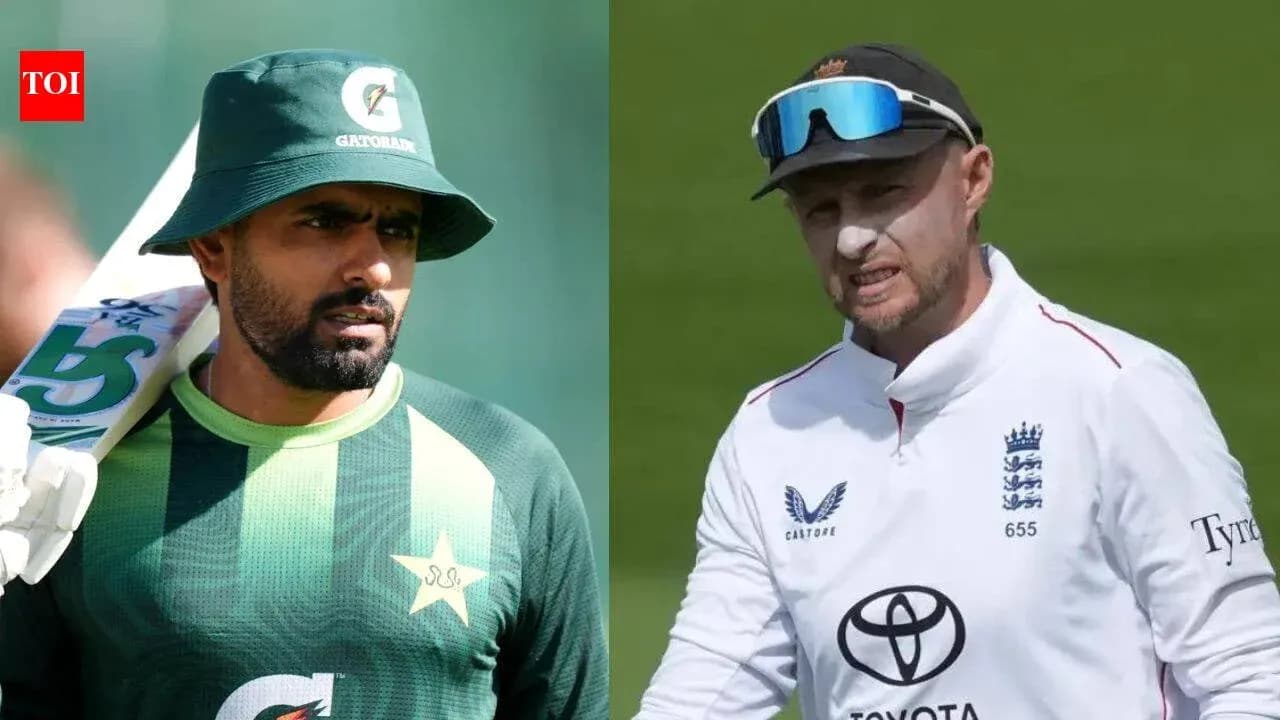 Two cricketers in team uniforms, Pakistan and England Two cricketers in team uniforms, Pakistan and England