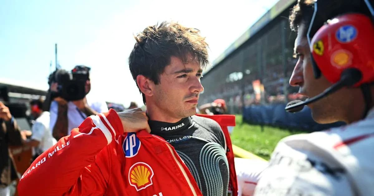 Driver preparing for race with team member beside Driver preparing for race with team member beside
