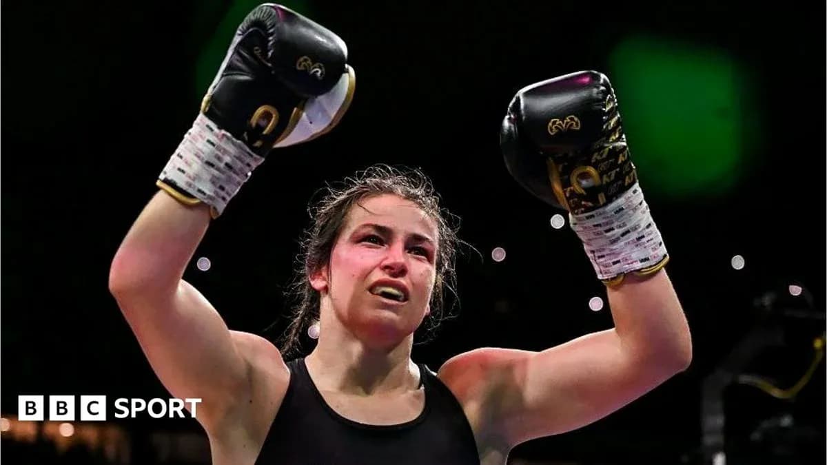 Boxer celebrating victory with raised gloves Boxer celebrating victory with raised gloves