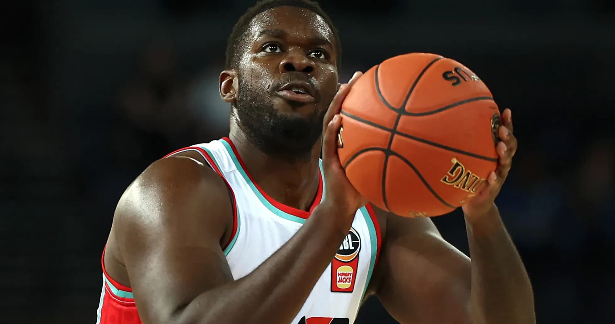 Player preparing to shoot basketball during game Player preparing to shoot basketball during game