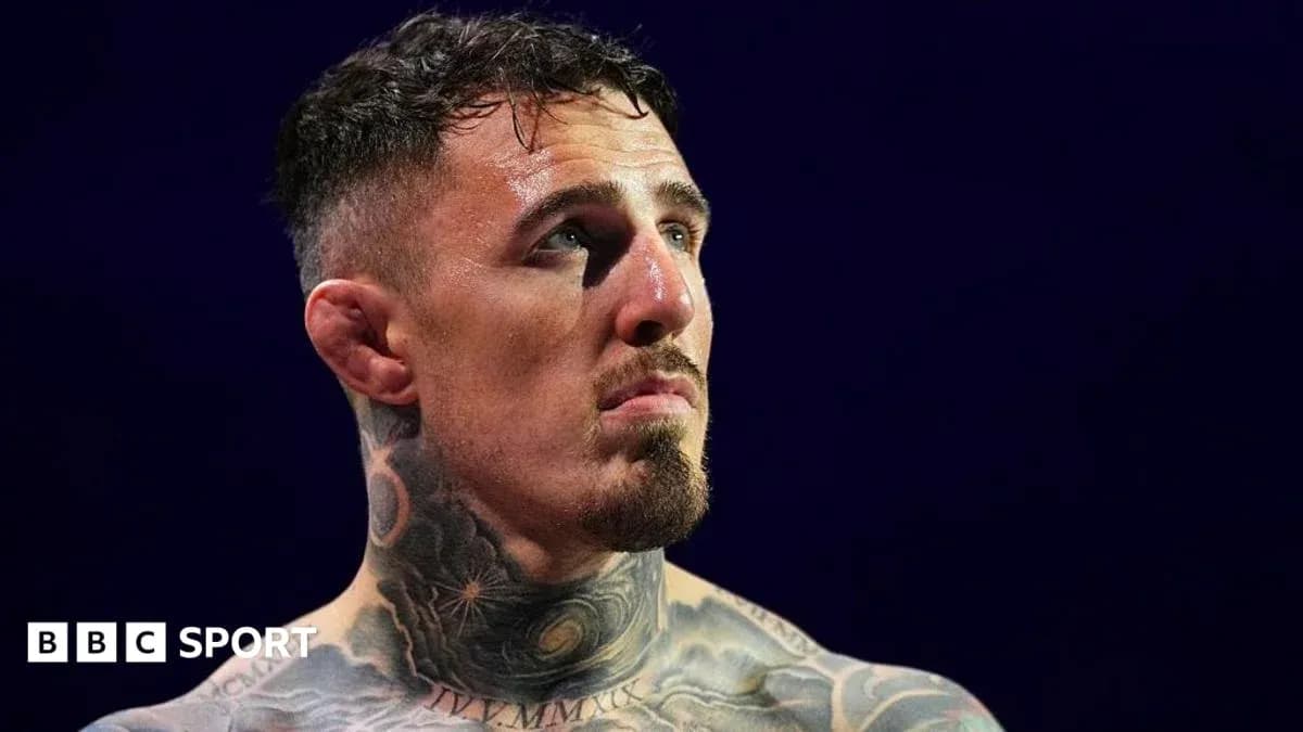 Tattooed fighter looking up in the ring Tattooed fighter looking up in the ring