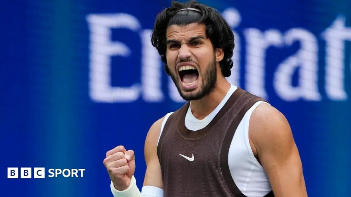 Tennis player celebrating with fist raised during match Tennis player celebrating with fist raised during match