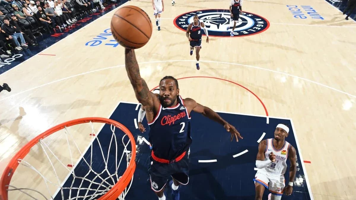 Player dunking the basketball during a game Player dunking the basketball during a game