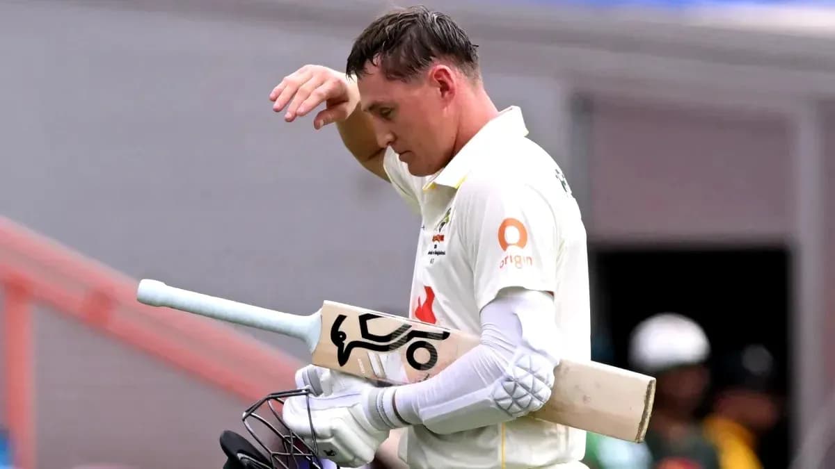 Cricketer walking off the field after batting Cricketer walking off the field after batting