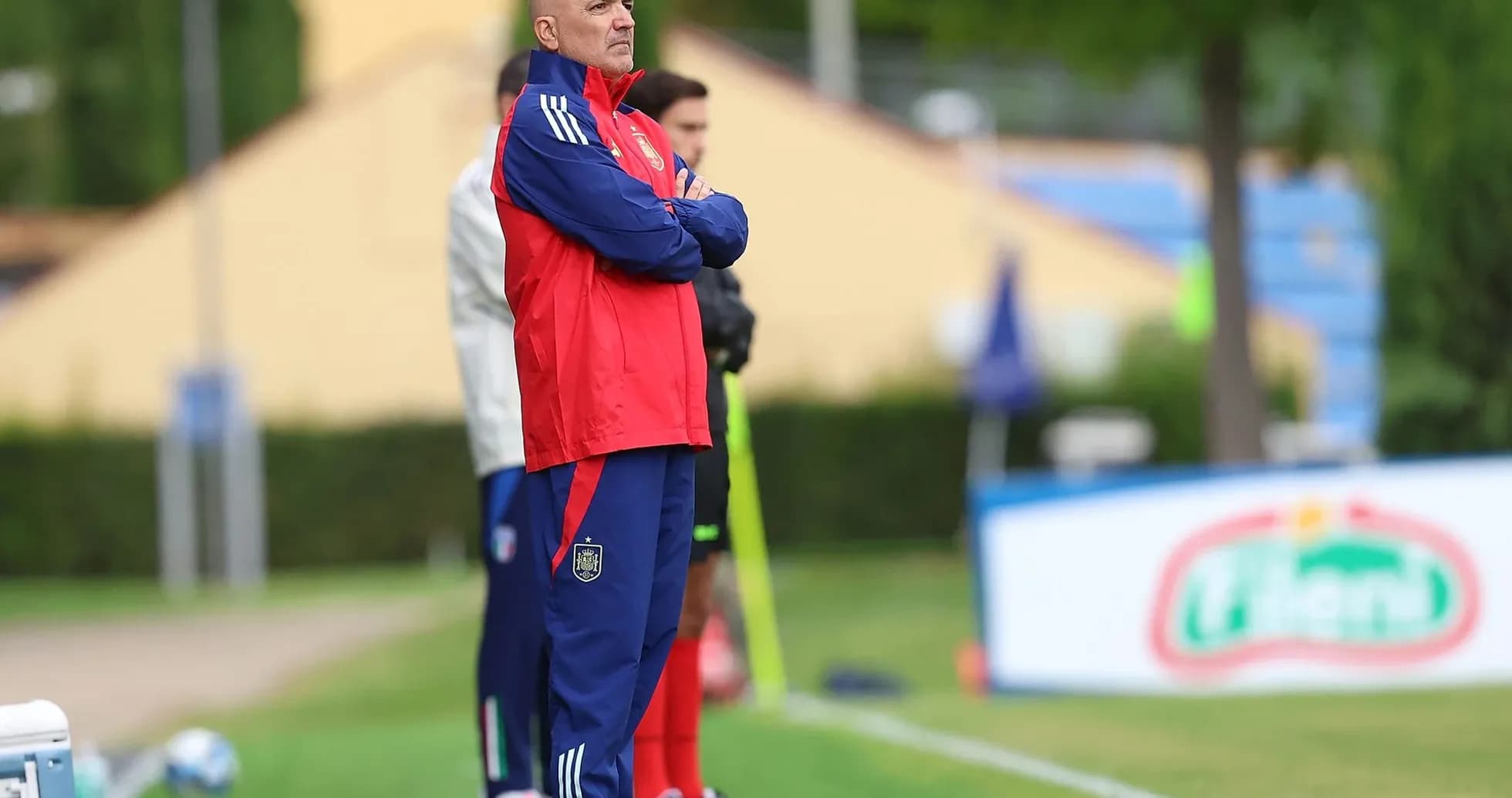 Coach observing from the sidelines during training session Coach observing from the sidelines during training session