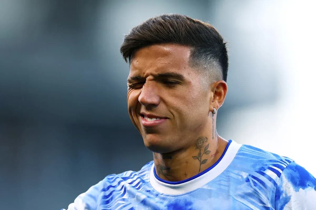 Player with tattoos in blue jersey winking Player with tattoos in blue jersey winking