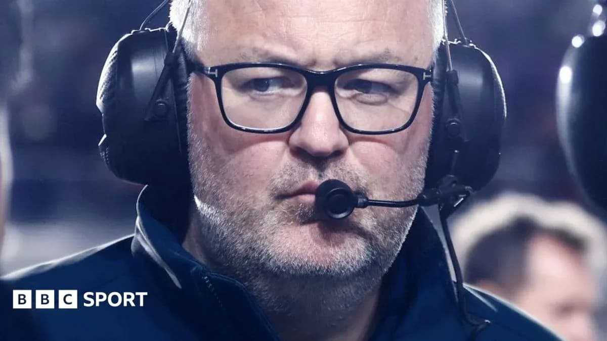 Coach wearing headset during a game Coach wearing headset during a game