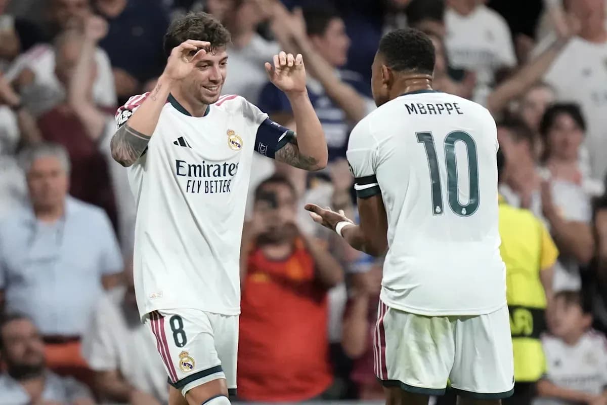 Real Madrid players celebrating a goal on the field Real Madrid players celebrating a goal on the field