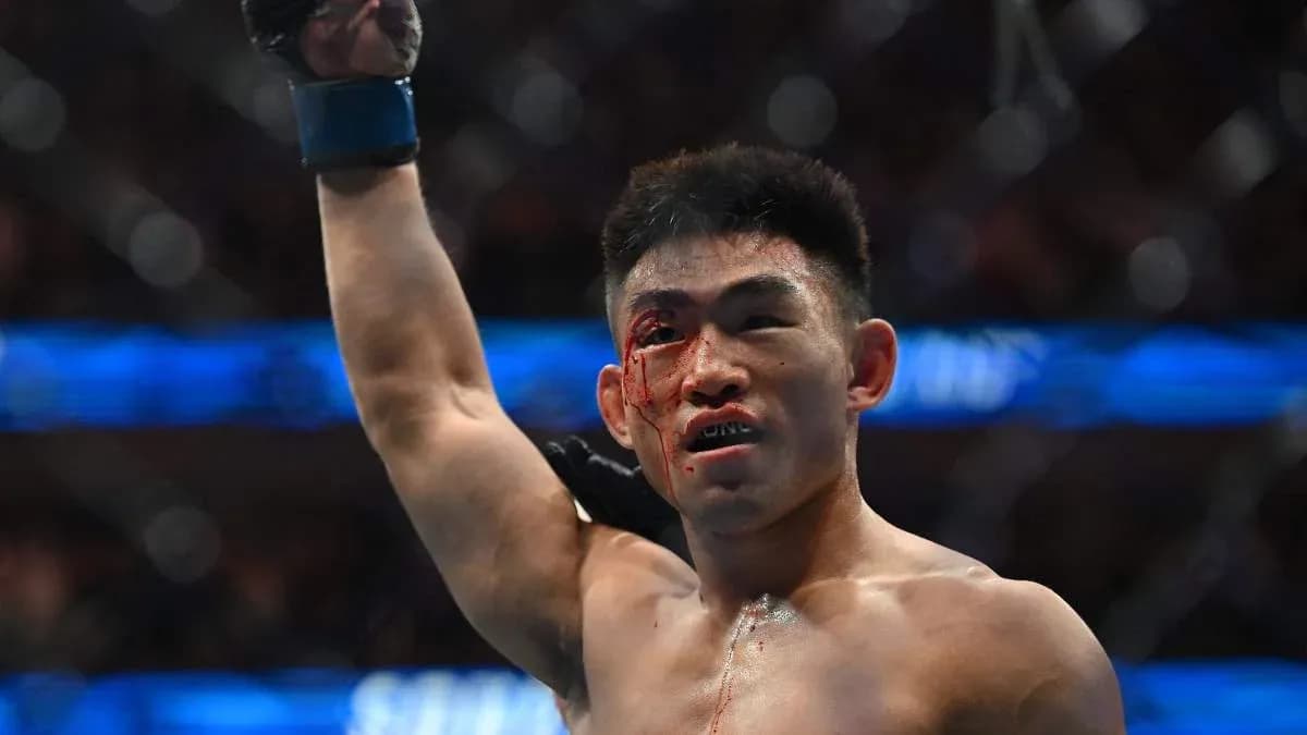 Fighter celebrating victory with blood on face Fighter celebrating victory with blood on face