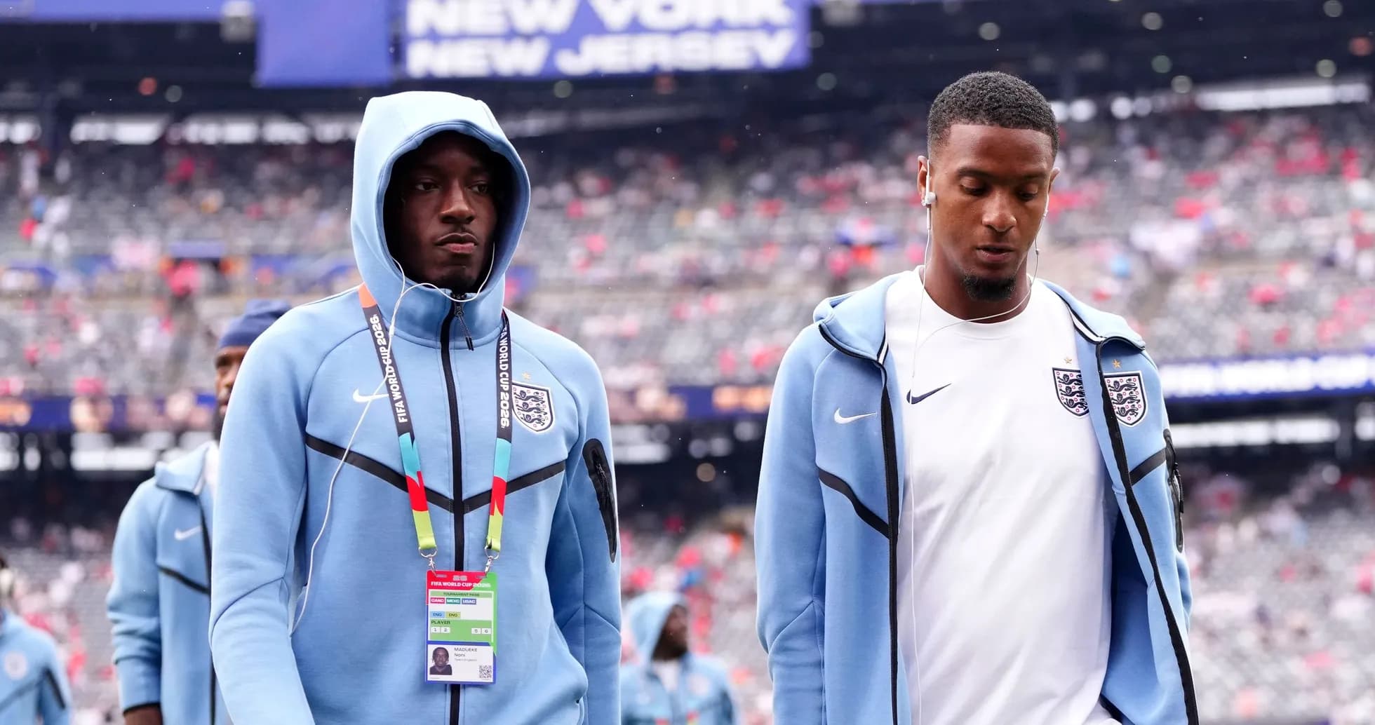 Two England players walking onto the field Two England players walking onto the field