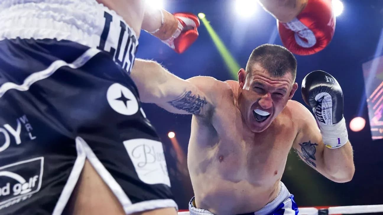 Boxer dodging a punch during intense match Boxer dodging a punch during intense match