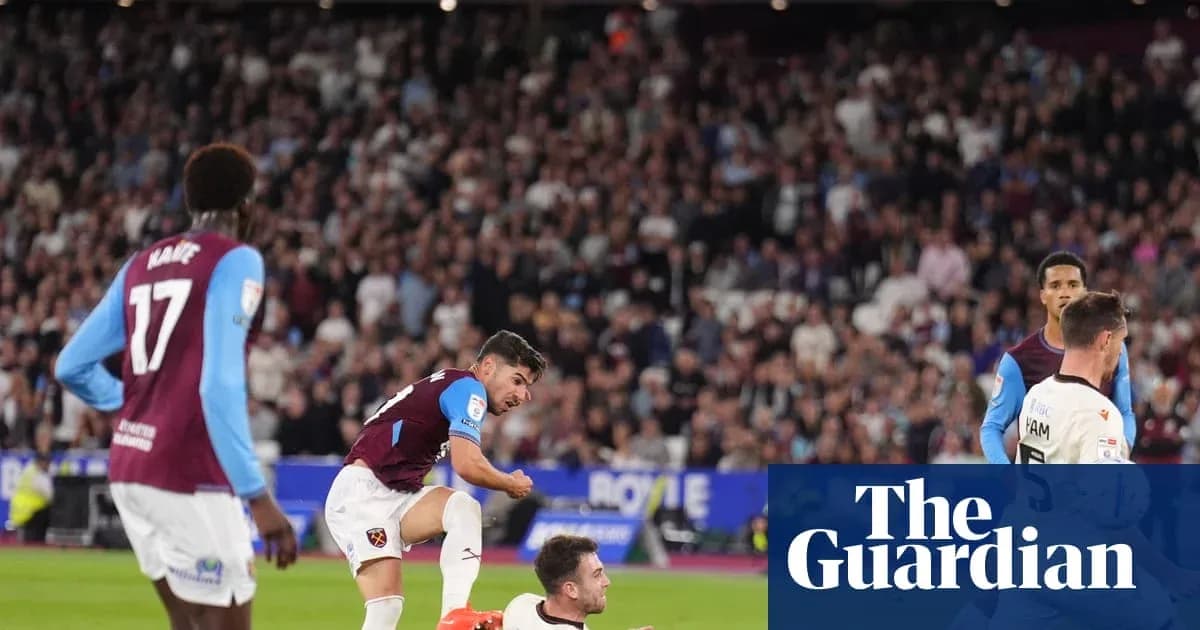 West Ham players celebrating a goal in the stadium West Ham players celebrating a goal in the stadium