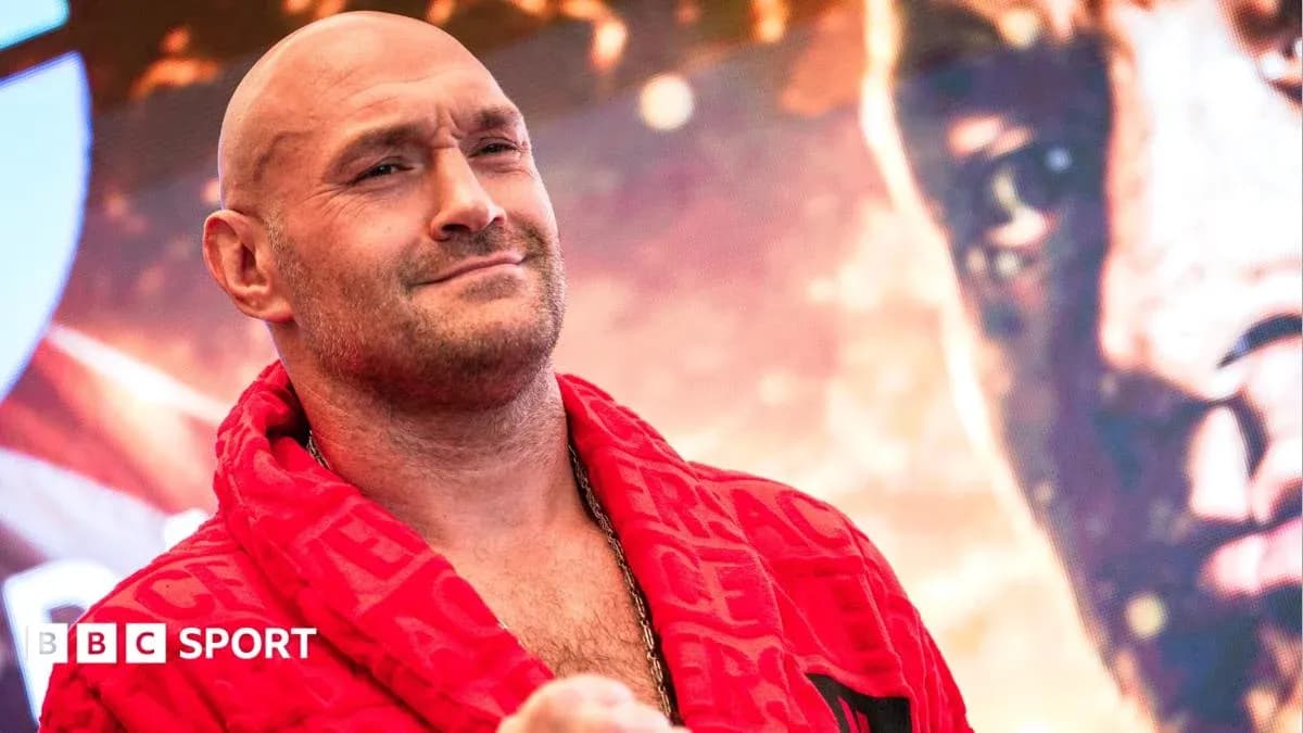 Boxer wearing red robe at promotional event Boxer wearing red robe at promotional event