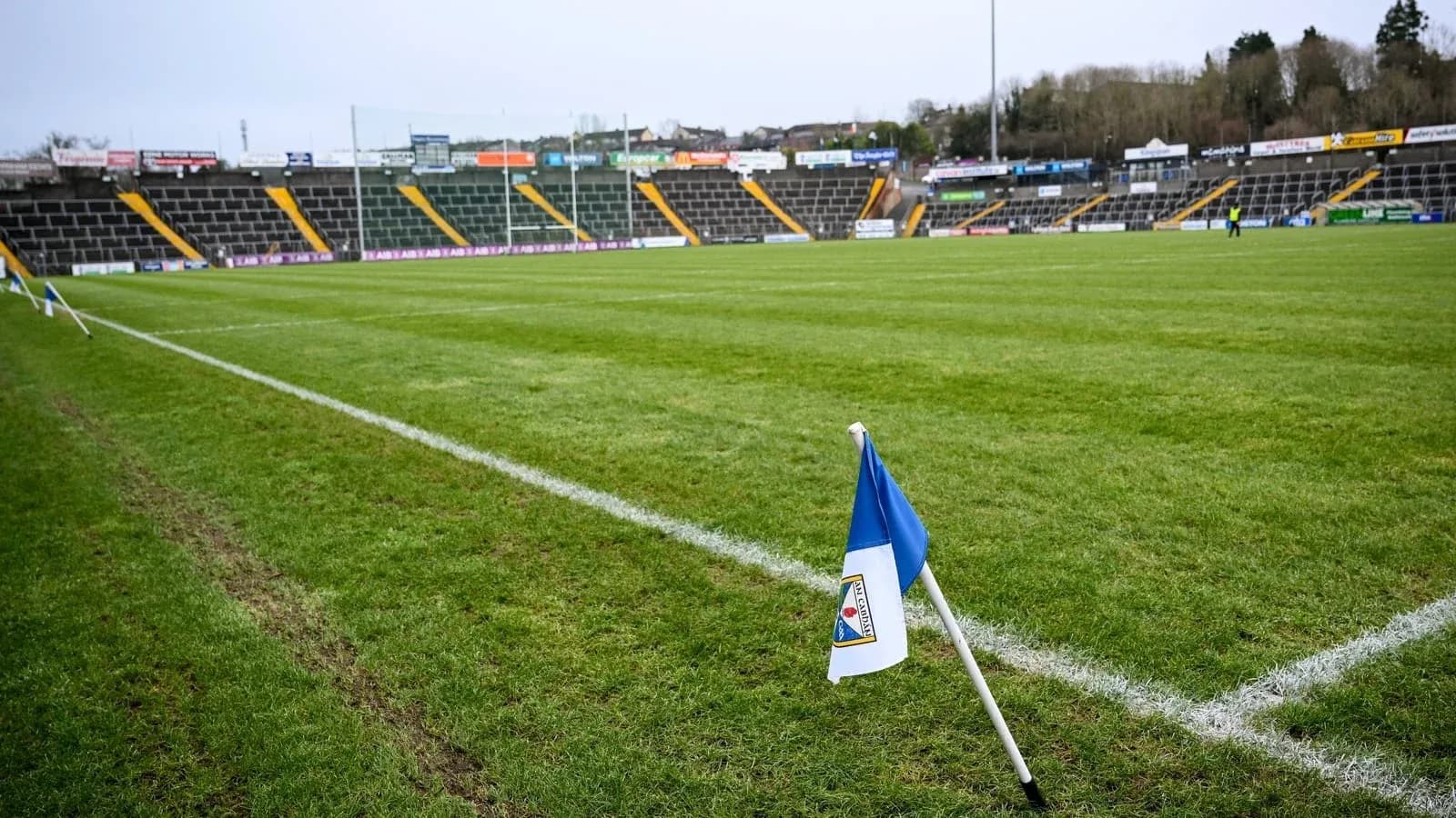 Corner flag on a rugby field with empty stands Corner flag on a rugby field with empty stands