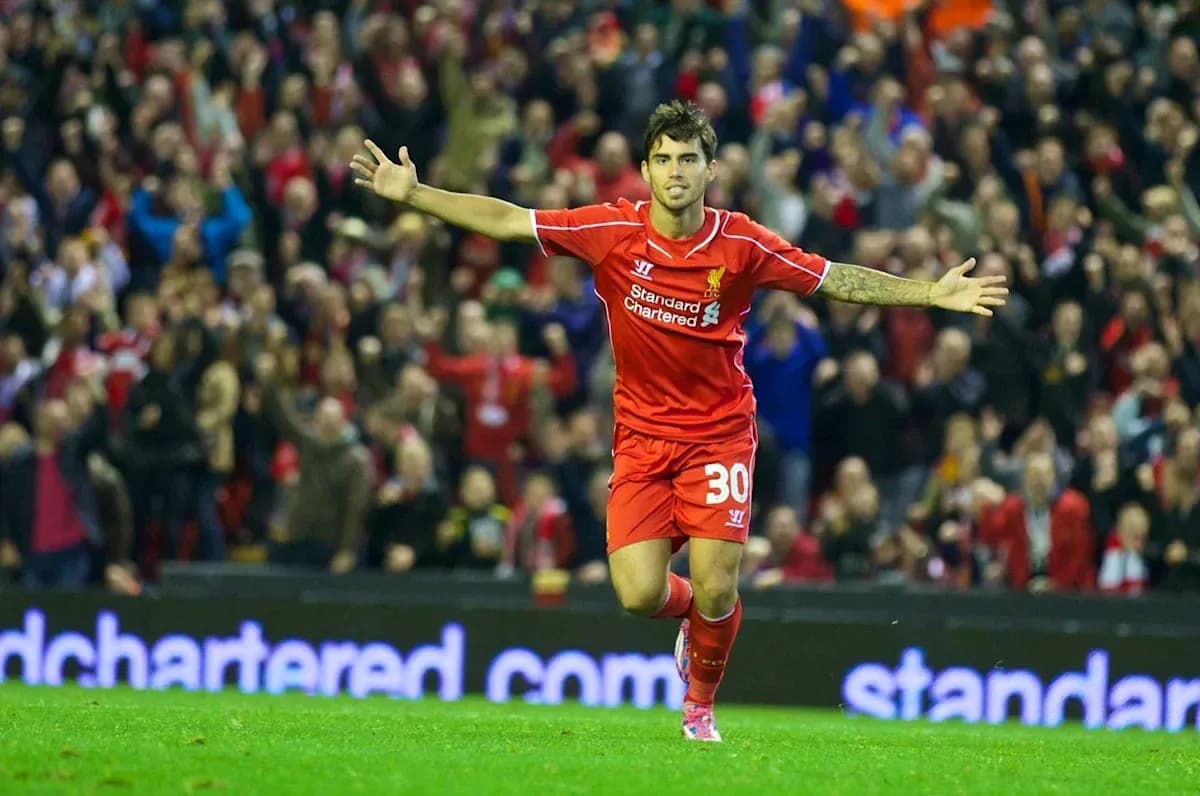 Player celebrating goal at Anfield stadium Player celebrating goal at Anfield stadium