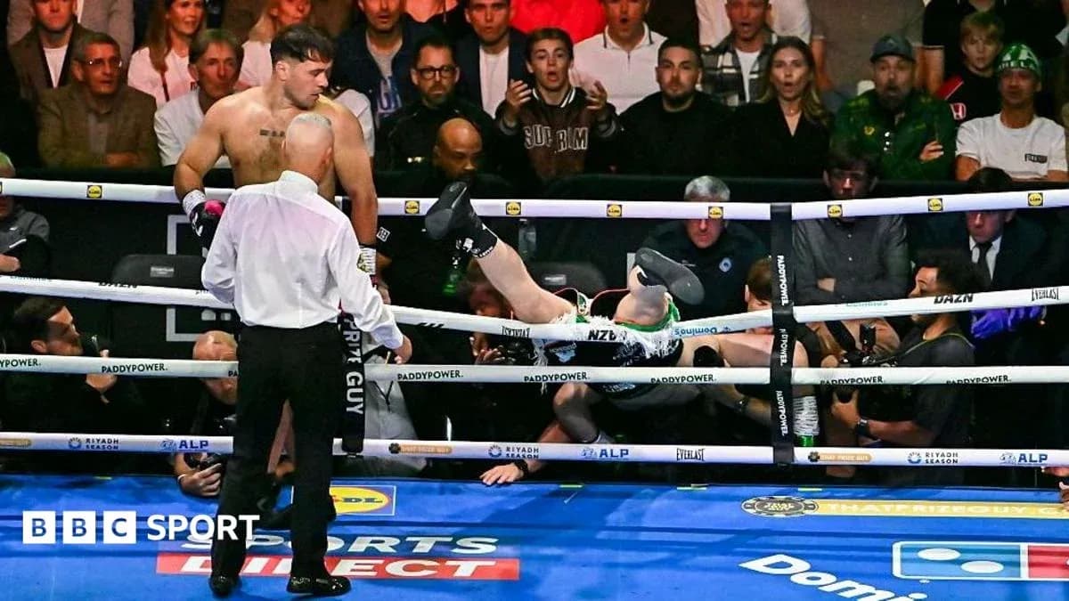 Boxer knocked out, falling outside the ring Boxer knocked out, falling outside the ring