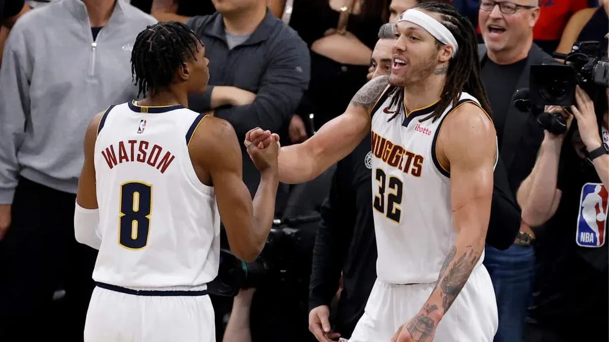 Two basketball players celebrating during game moment Two basketball players celebrating during game moment