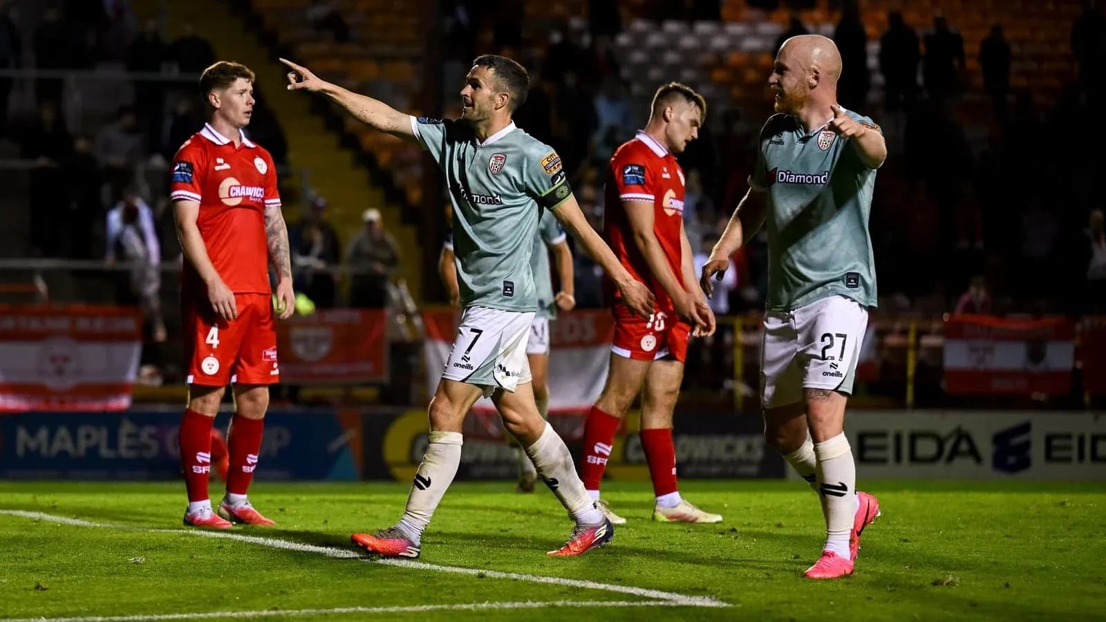 Players celebrating after a goal during match Players celebrating after a goal during match