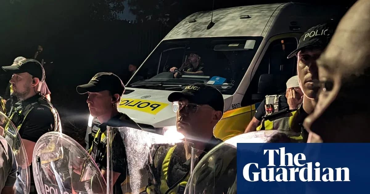 Police officers with shields and van at night Police officers with shields and van at night
