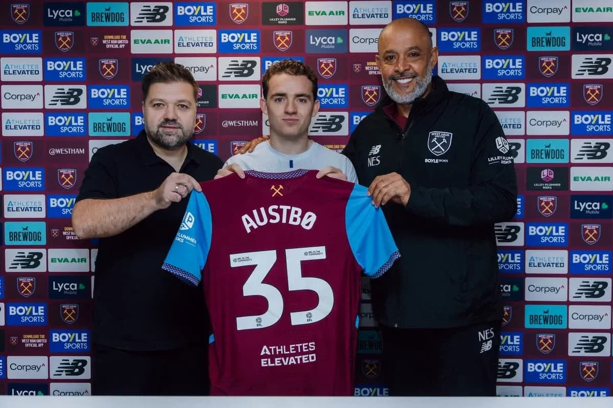 Player holding new jersey with club representatives Player holding new jersey with club representatives