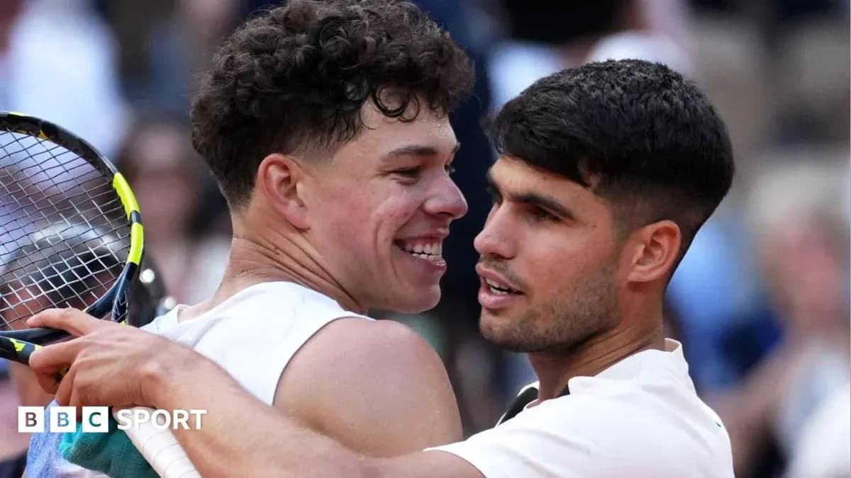 Two tennis players embracing on the court Two tennis players embracing on the court