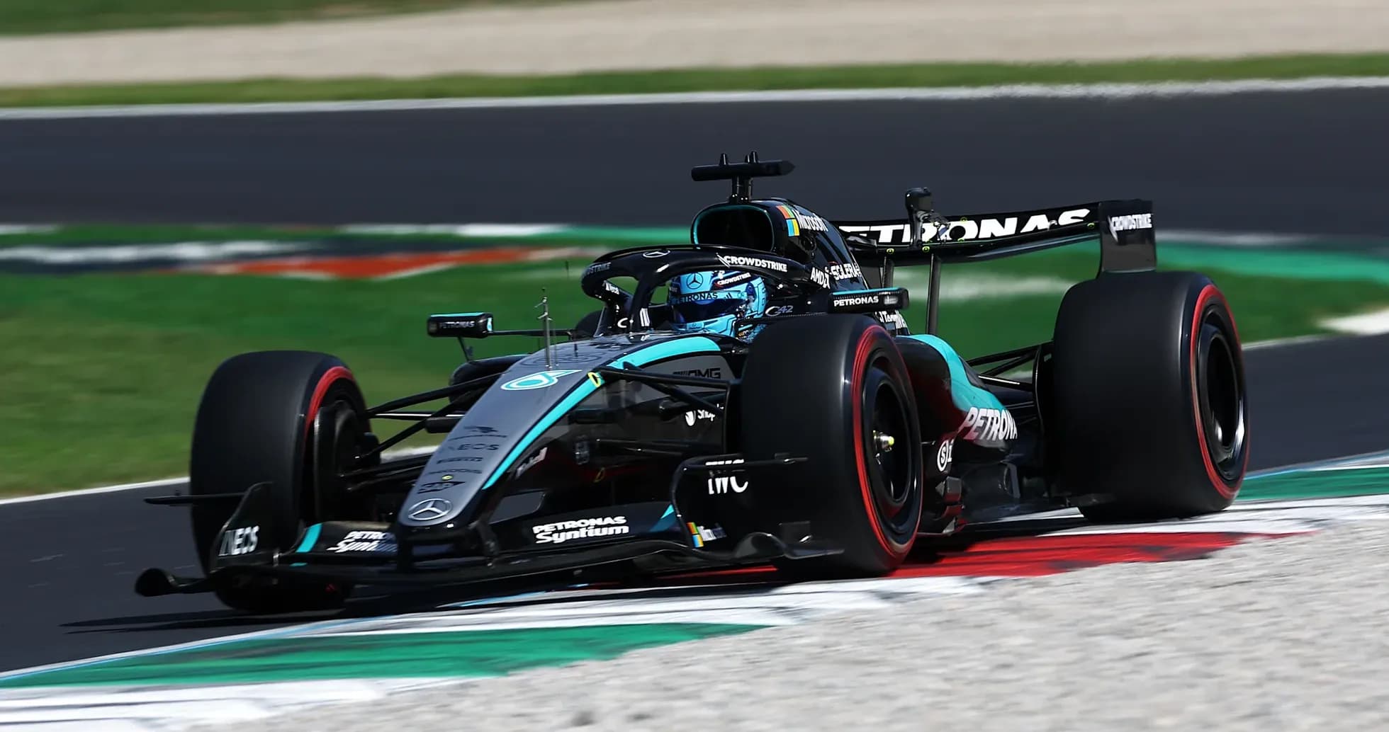 Mercedes F1 car racing on track during event Mercedes F1 car racing on track during event